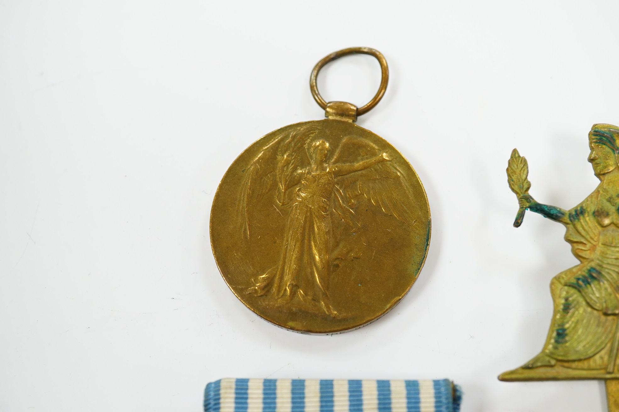 A First World War medal pair awarded to SJT. F.C. Howkins, The Queen’s R., together with a QEII Korea medal pair awarded to CPL. T.A. Howkins, R. Norfolk, plus a Lusitania propaganda medallion, all contained in a Princes